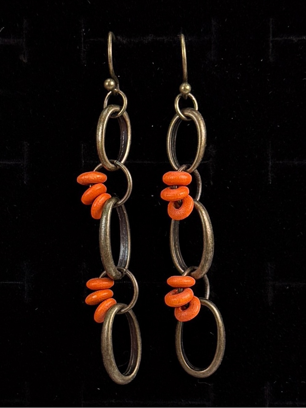 Bohemian chic linked long, orange bead pierced earrings